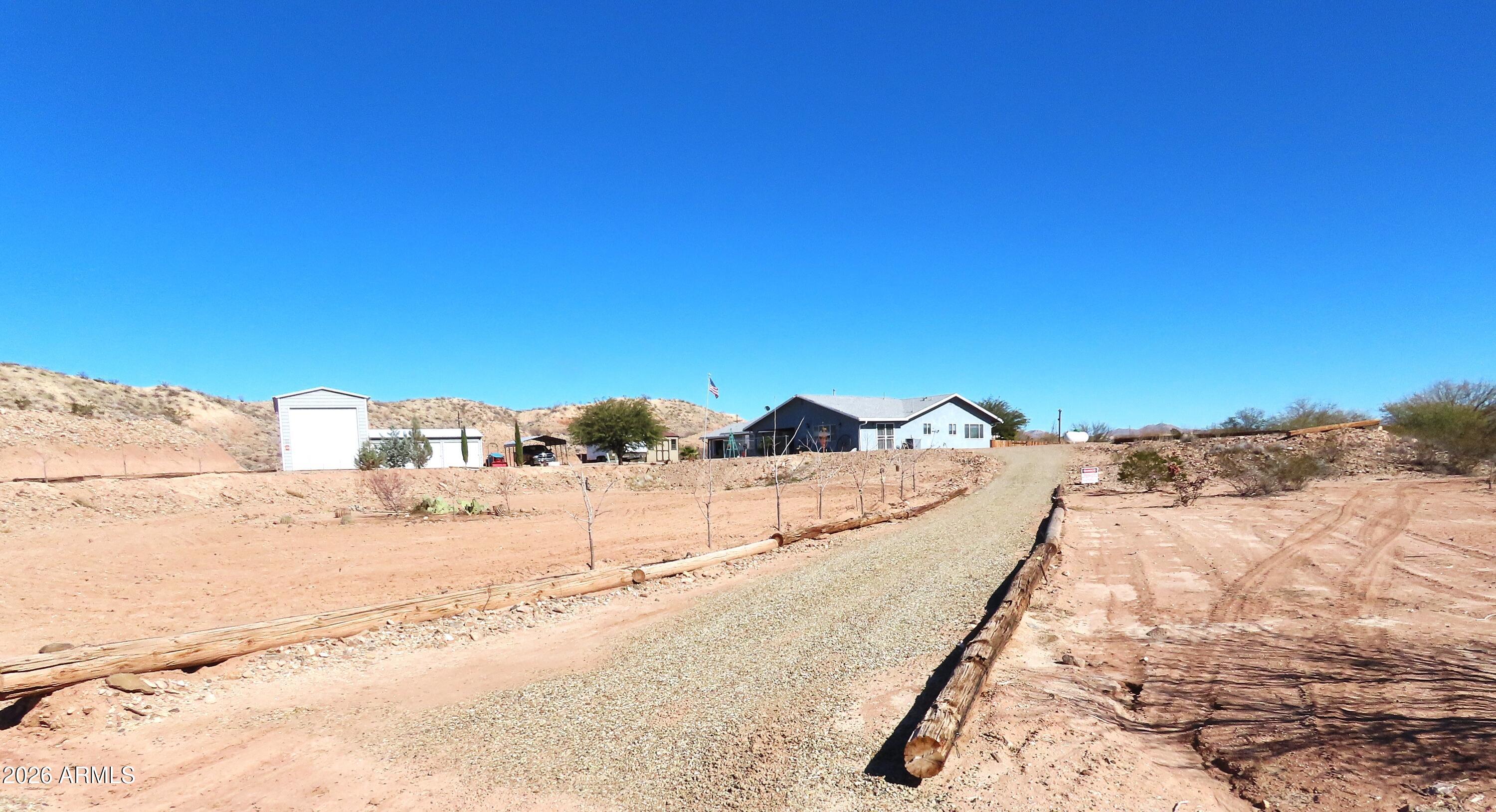 311 North Saddle Vista Road Benson, AZ 85602 - Photo 2 of 36 a view of a road with a snow in the background