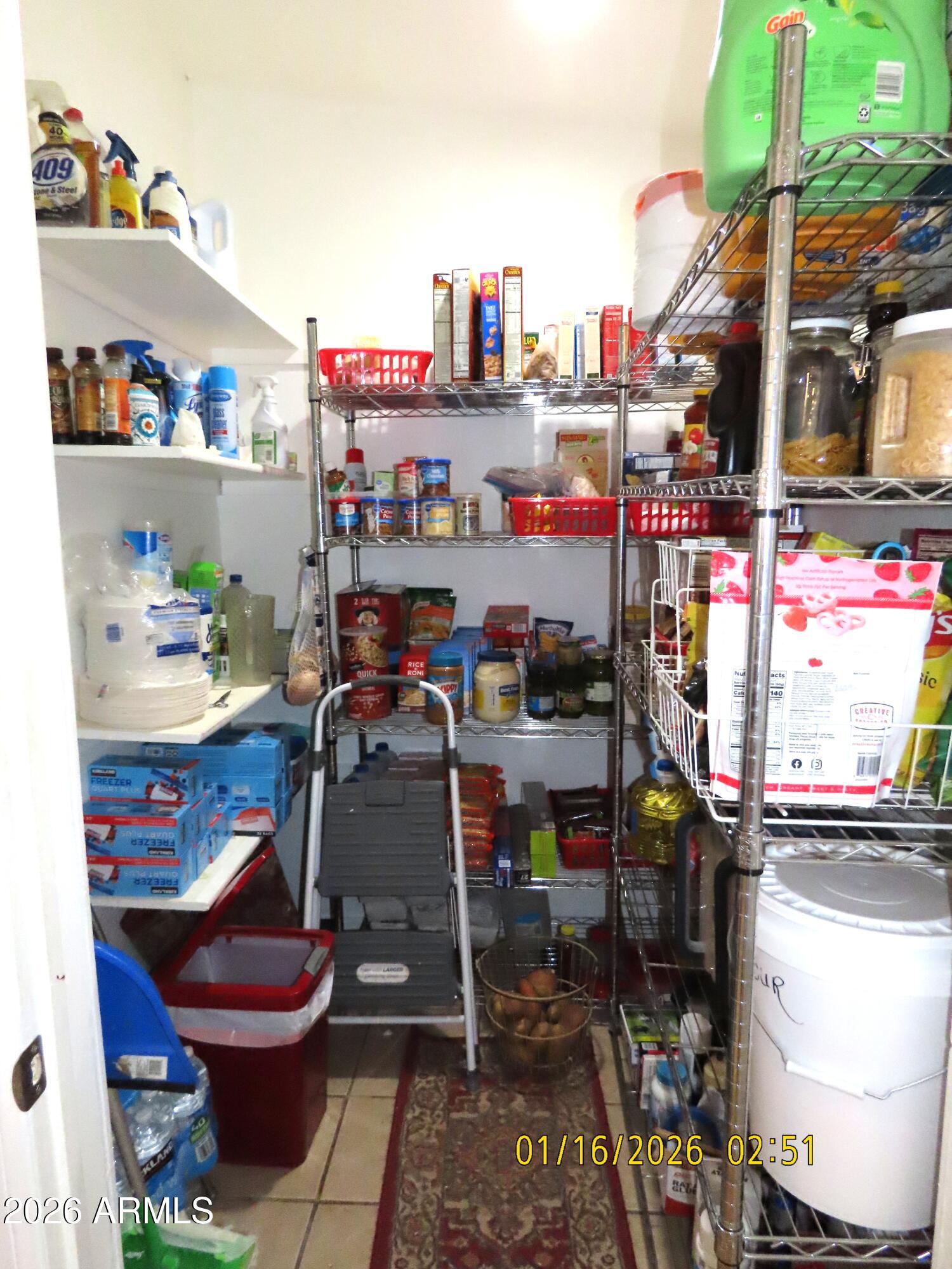 311 North Saddle Vista Road Benson, AZ 85602 - Photo 21 of 36 a room with stainless steel appliances kitchen island granite countertop a table and chairs