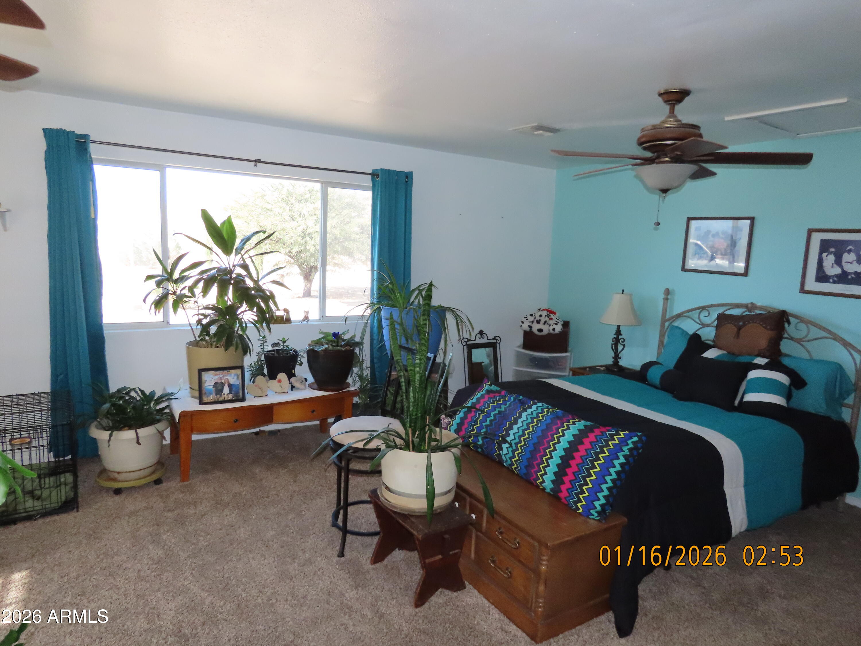 311 North Saddle Vista Road Benson, AZ 85602 - Photo 22 of 36 a living room with furniture and a large window
