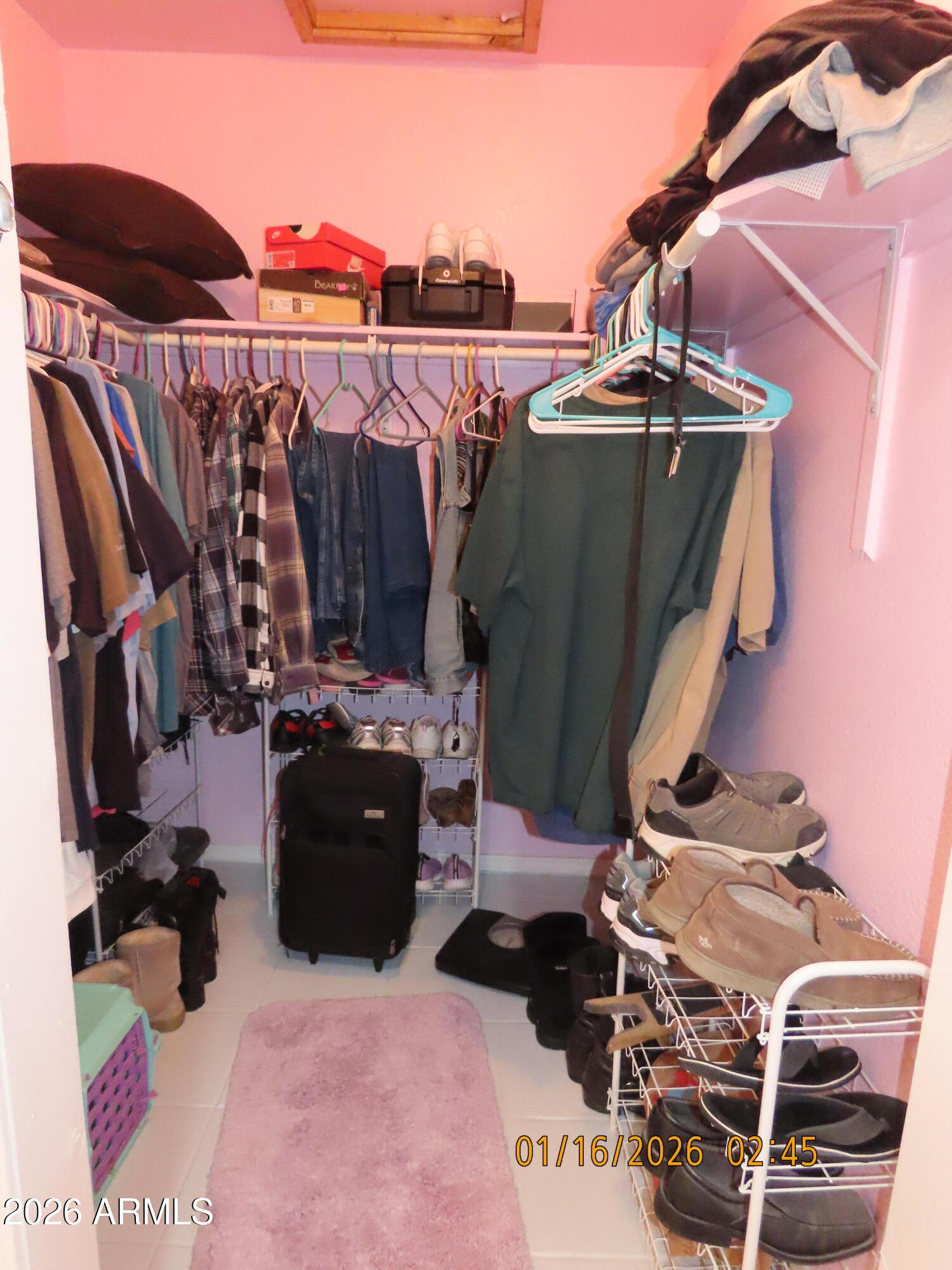 311 North Saddle Vista Road Benson, AZ 85602 - Photo 31 of 36 a view of walk in closet with clothes and shoes