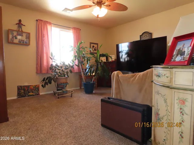 a room with furniture and a flat screen tv