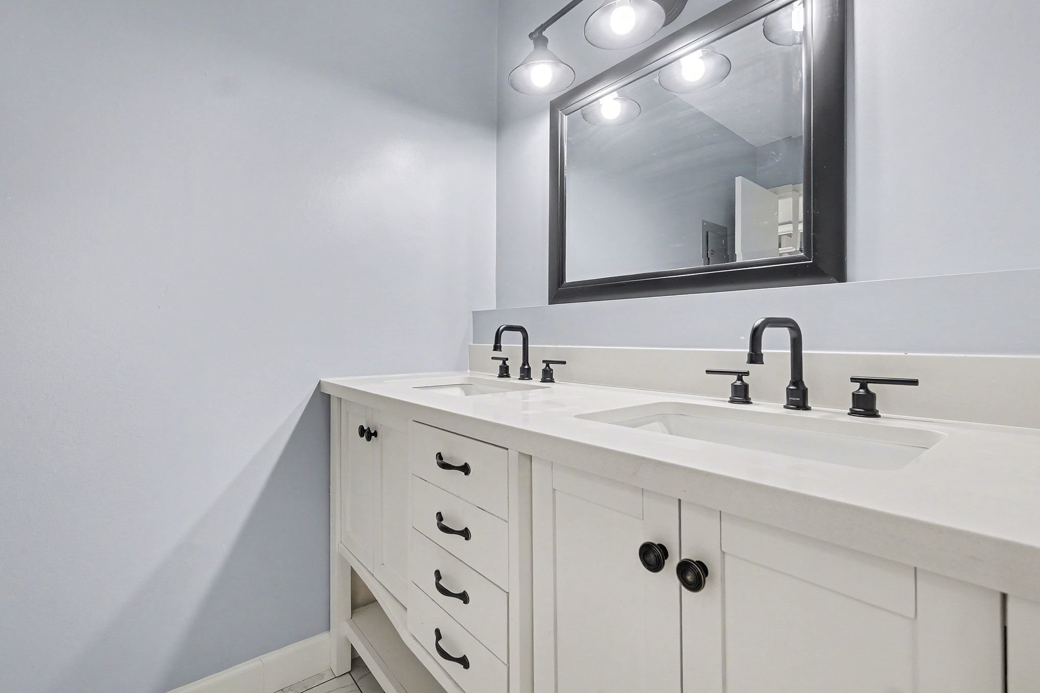500 Paragon Mills Road, Unit N13 Nashville, TN 37211 - Photo 6 of 12 a bathroom with a double vanity sink and mirror