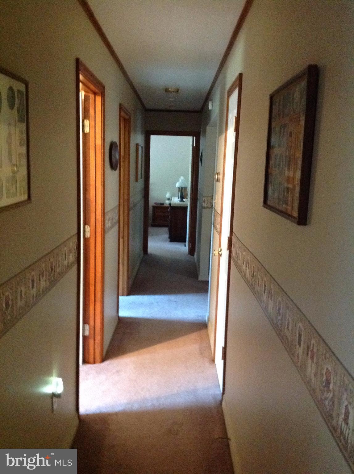 255 Ebenezer Road Halifax, PA 17032 - Photo 25 of 63 a view of a hallway with wooden floor and windows