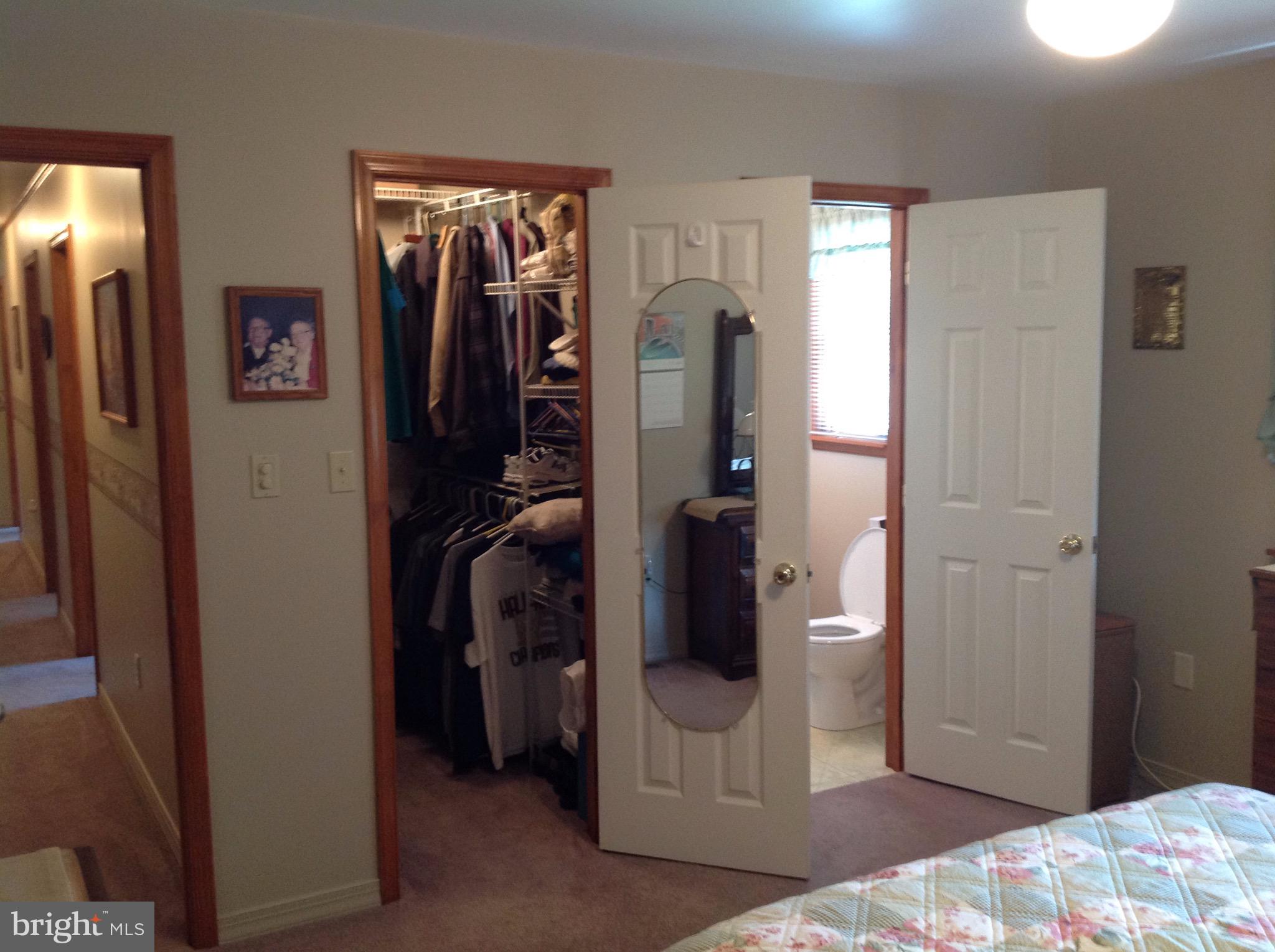 255 Ebenezer Road Halifax, PA 17032 - Photo 33 of 63 a bedroom with a bed and a mirror