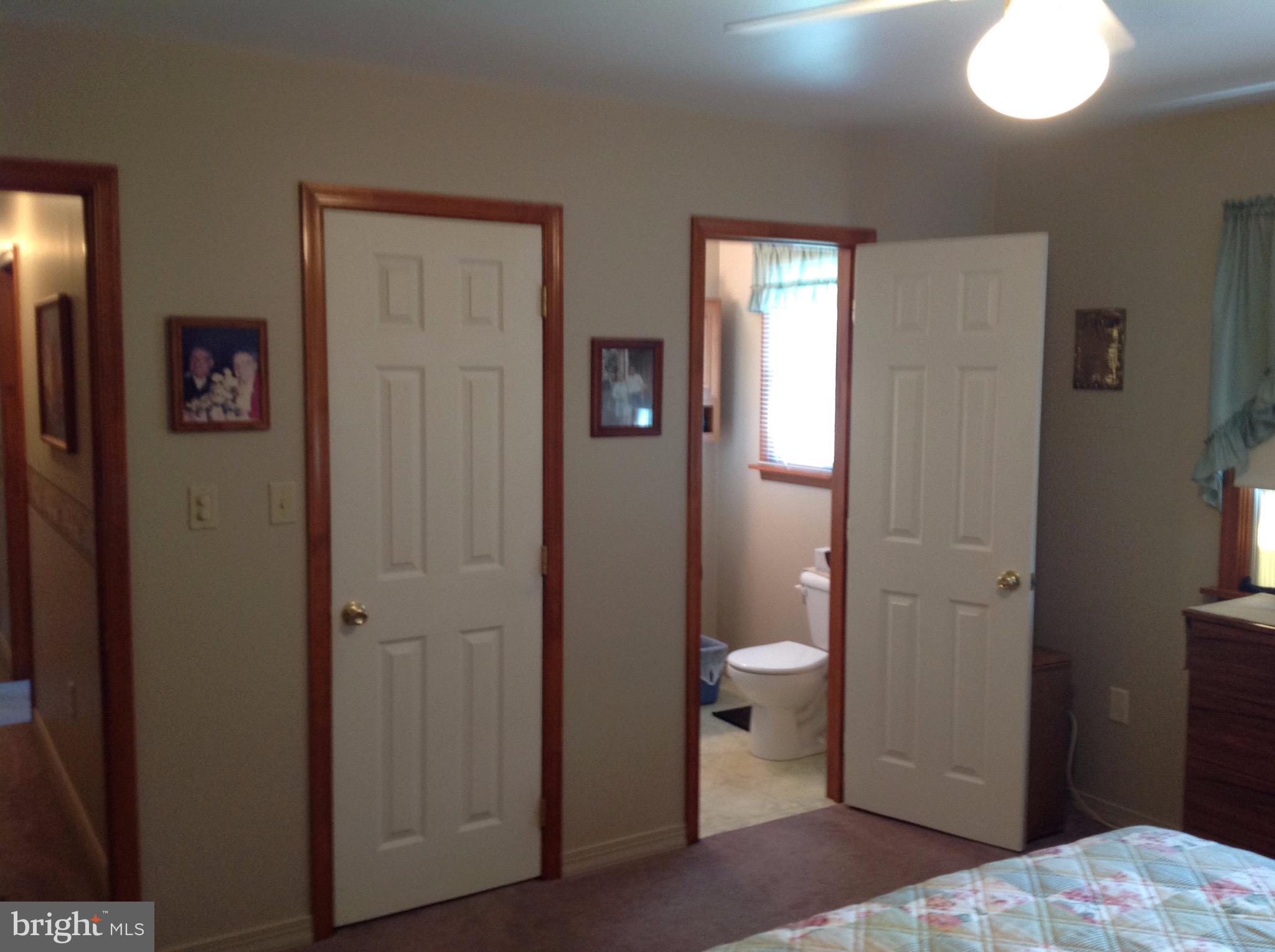 255 Ebenezer Road Halifax, PA 17032 - Photo 35 of 63 a bedroom with a bed and a bathroom