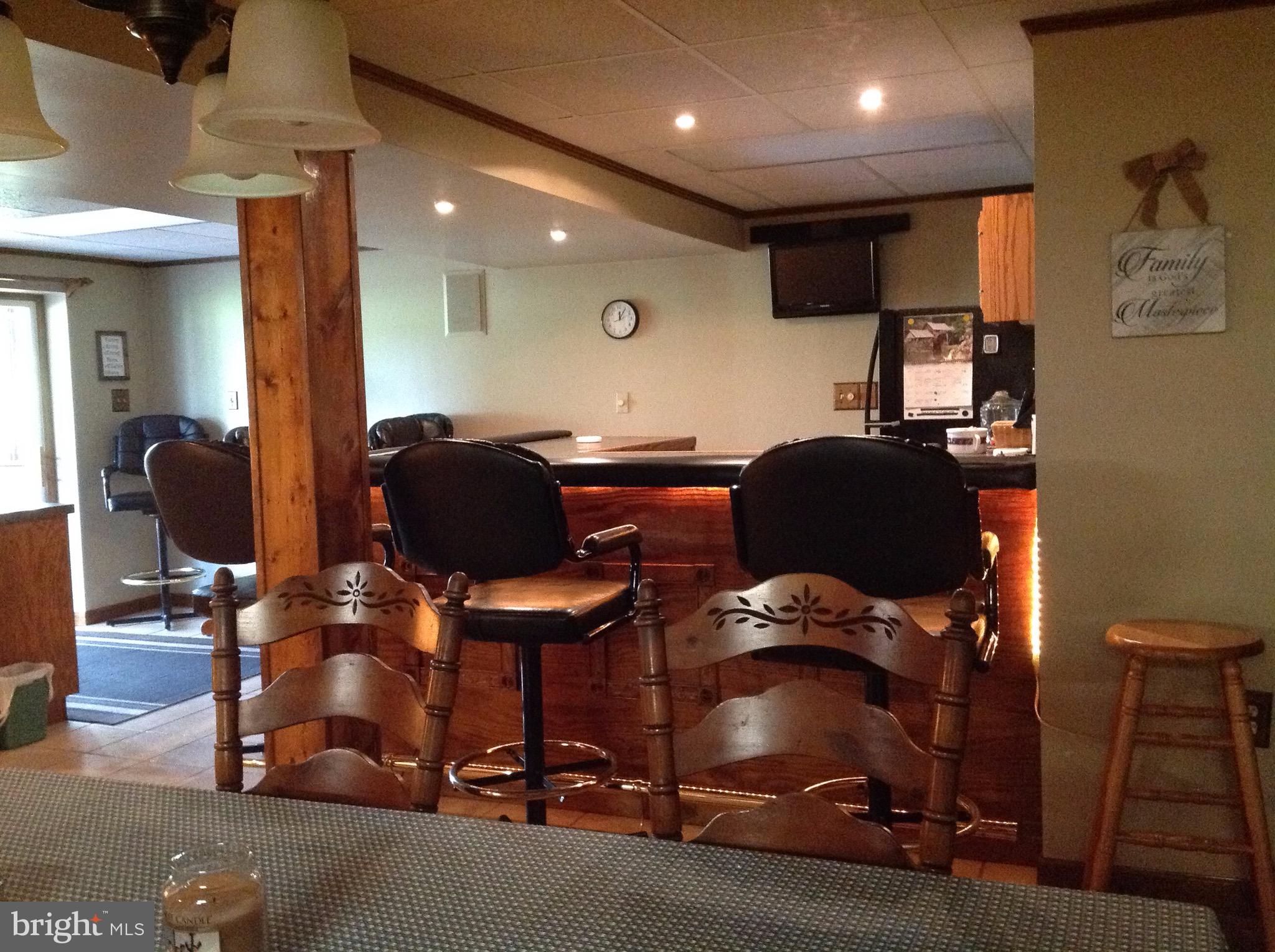 255 Ebenezer Road Halifax, PA 17032 - Photo 48 of 63 a room with gym equipment and a chandelier