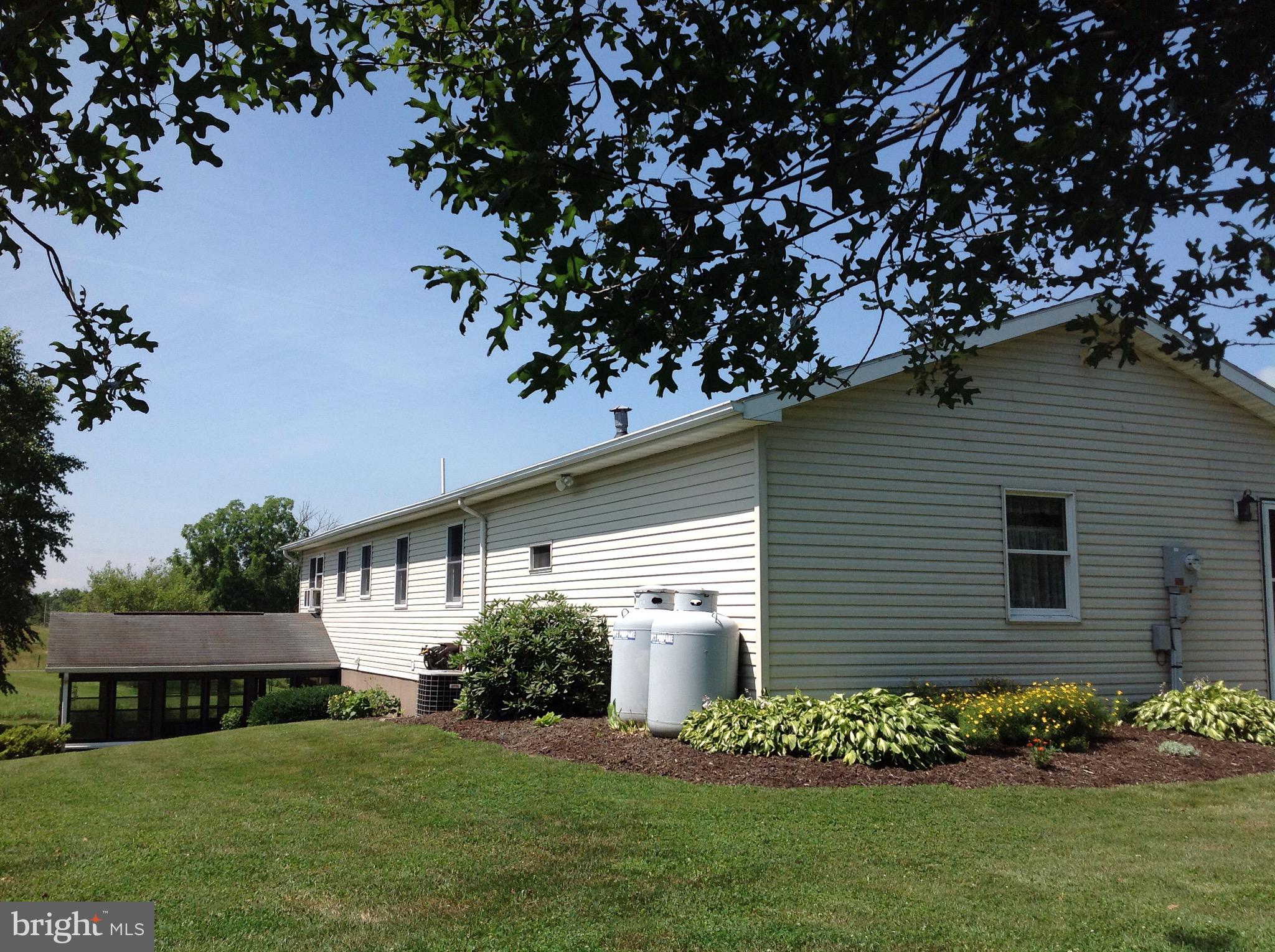 255 Ebenezer Road Halifax, PA 17032 - Photo 6 of 63 a front view of a house with a garden