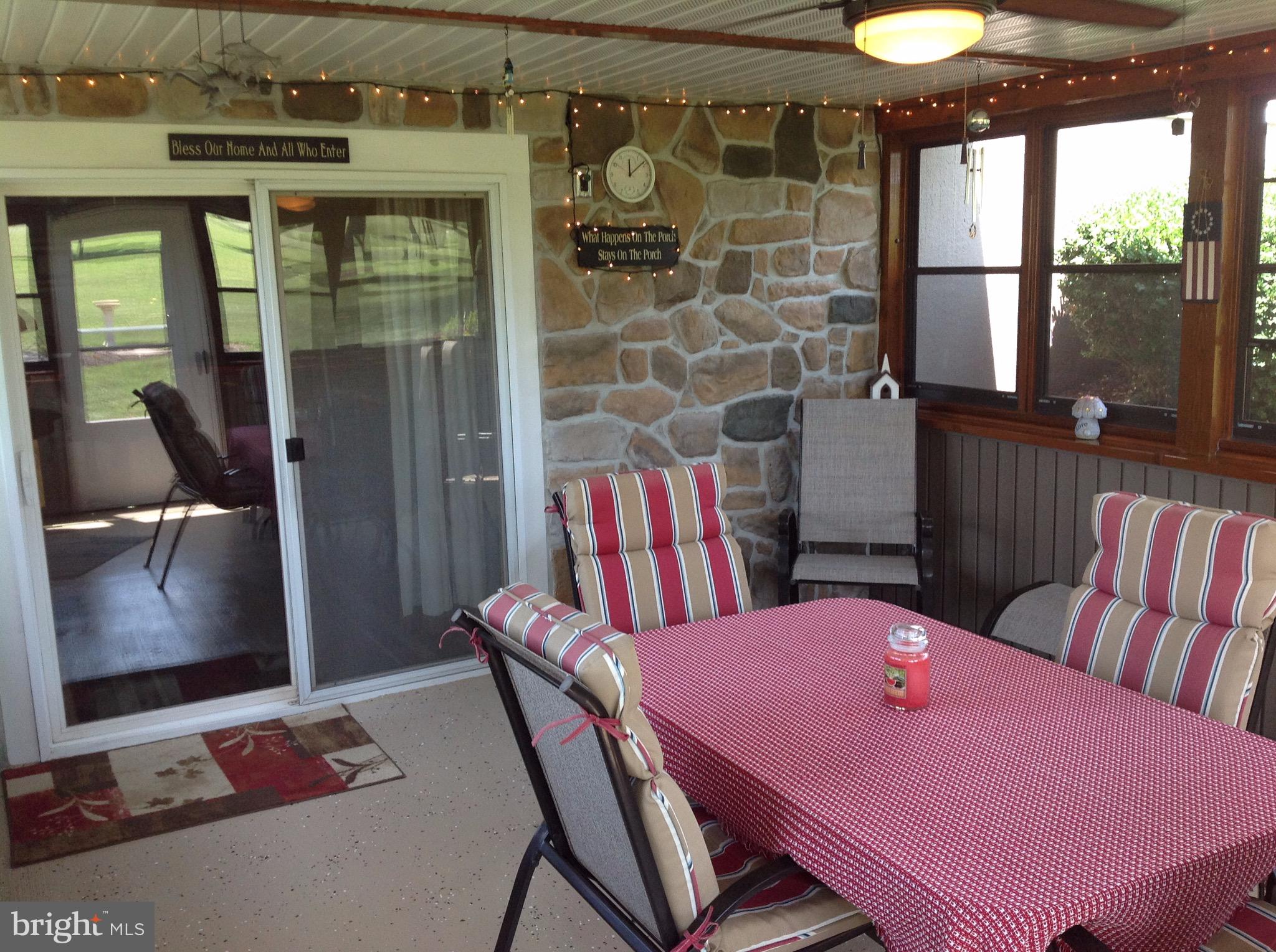255 Ebenezer Road Halifax, PA 17032 - Photo 52 of 63 a view of a dining room with furniture window and wooden floor