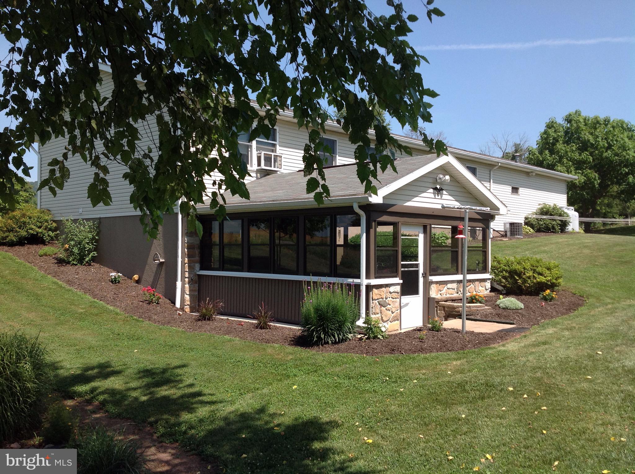 255 Ebenezer Road Halifax, PA 17032 - Photo 8 of 63 a view of a house with a yard porch and sitting area