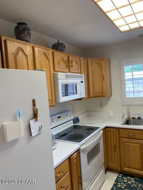 49 Rivocean Drive Ormond Beach, FL 32176 - Photo 2 of 22 a kitchen that has a sink and a stove top oven