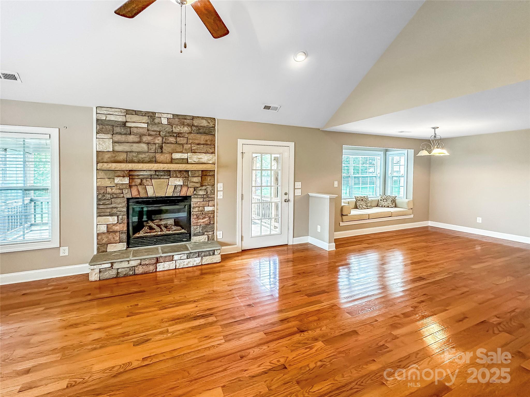 1625 Damascus Circle Conover, NC 28613 - Photo 15 of 40 an empty room with floor to ceiling window and fireplace