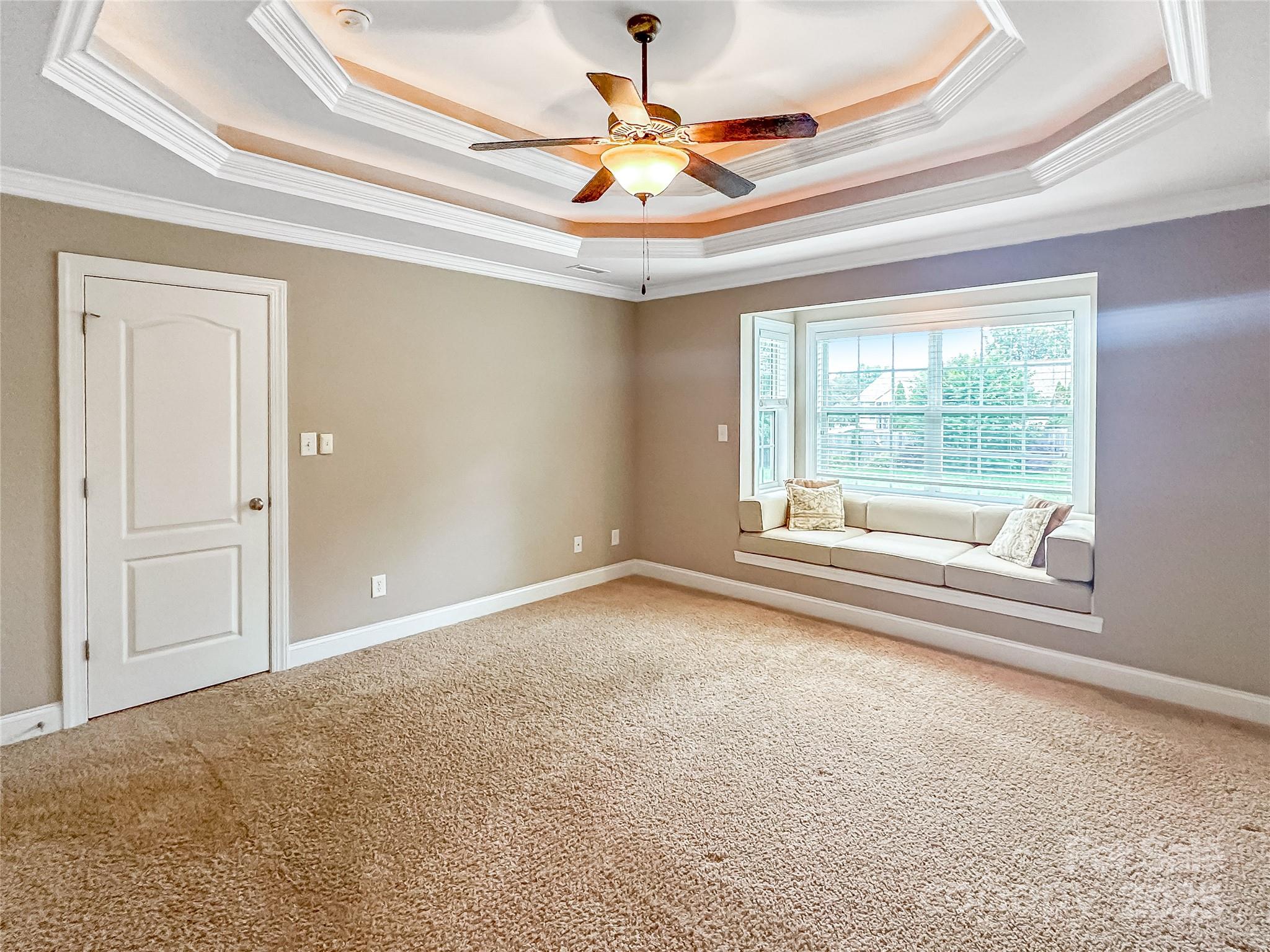 1625 Damascus Circle Conover, NC 28613 - Photo 17 of 40 en empty room with windows and ceiling fan