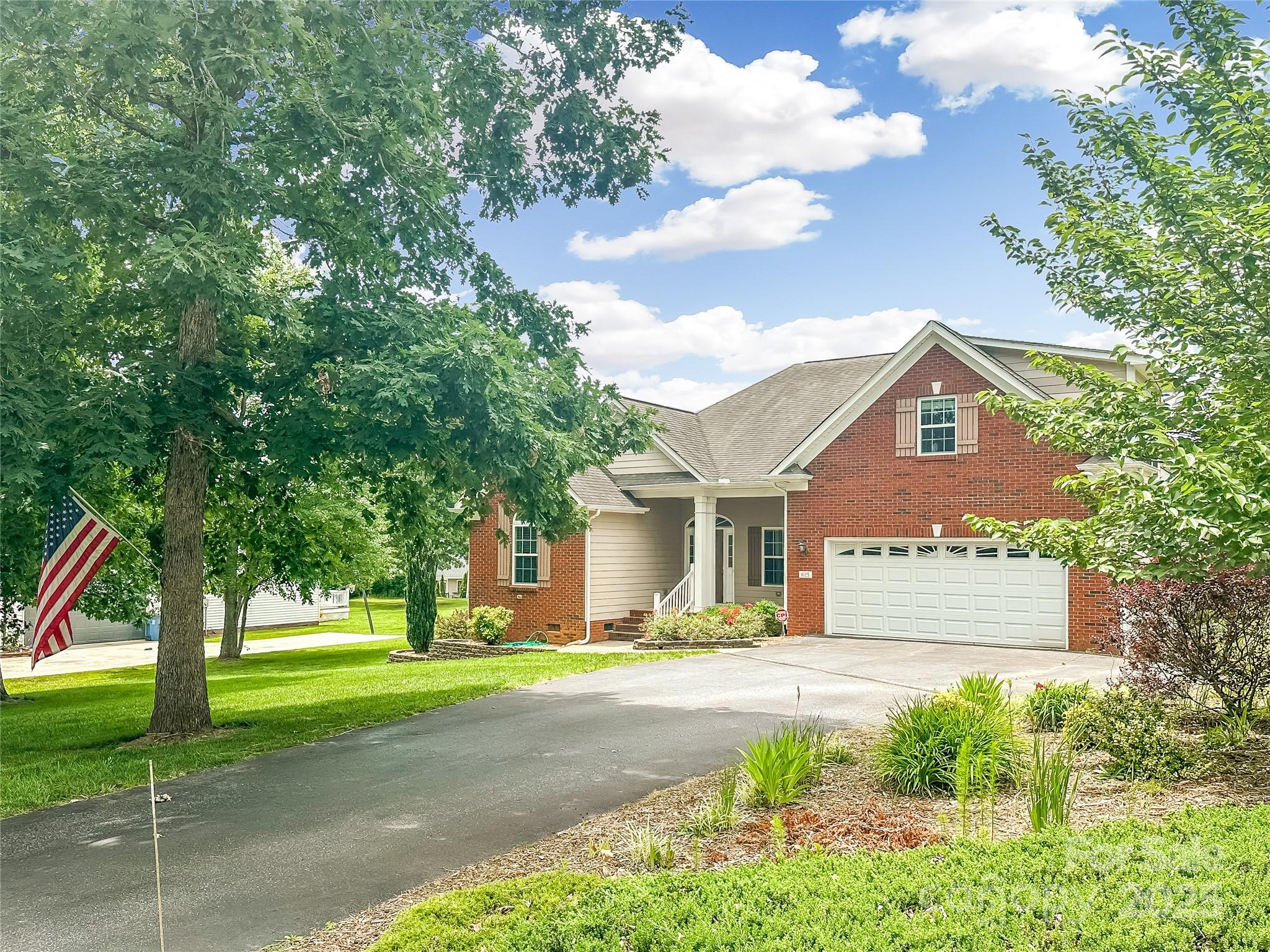 1625 Damascus Circle Conover, NC 28613 - Photo 39 of 40 a front view of a house with a yard and garage