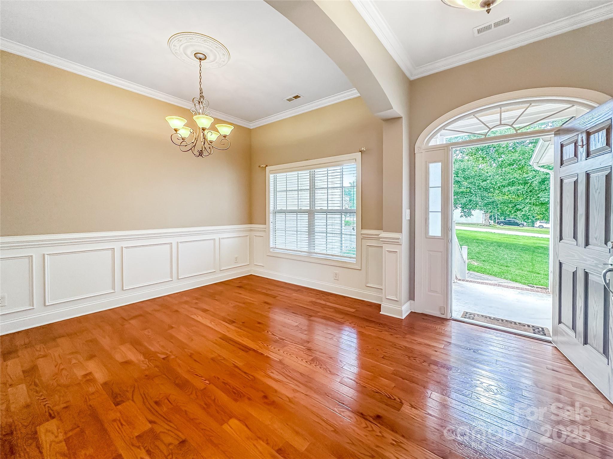 1625 Damascus Circle Conover, NC 28613 - Photo 9 of 40 a view of an empty room with a window and wooden floor