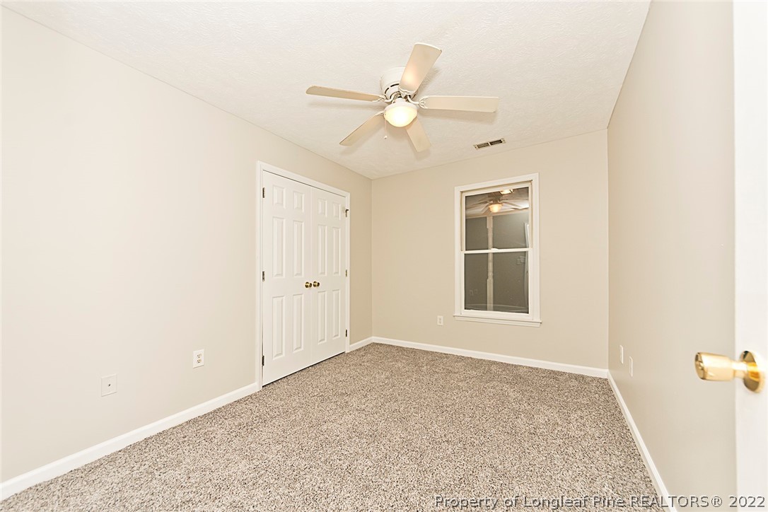 406 Kernstown Road Raeford, NC 28376 - Photo 12 of 22 a view of an empty room with a window