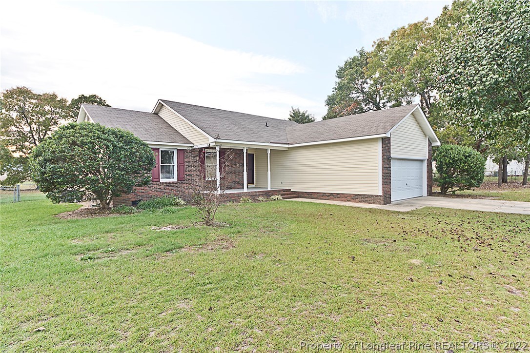 406 Kernstown Road Raeford, NC 28376 - Photo 2 of 22 a view of a house with a backyard