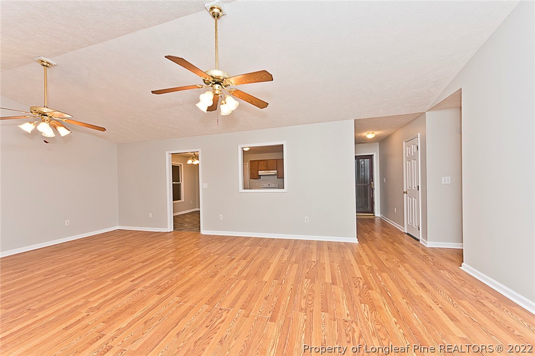 406 Kernstown Road Raeford, NC 28376 - Photo 6 of 22 a view of empty room with wooden floor