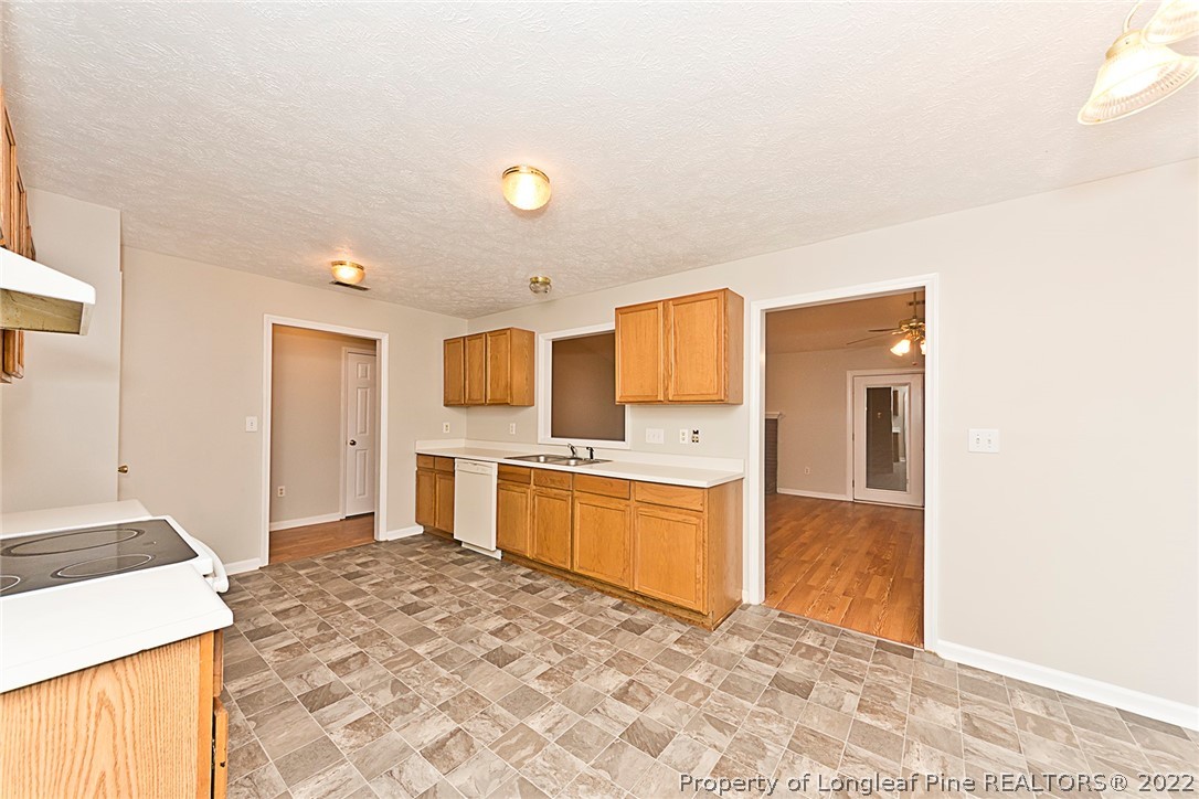 406 Kernstown Road Raeford, NC 28376 - Photo 7 of 22 a kitchen with a refrigerator sink and stove