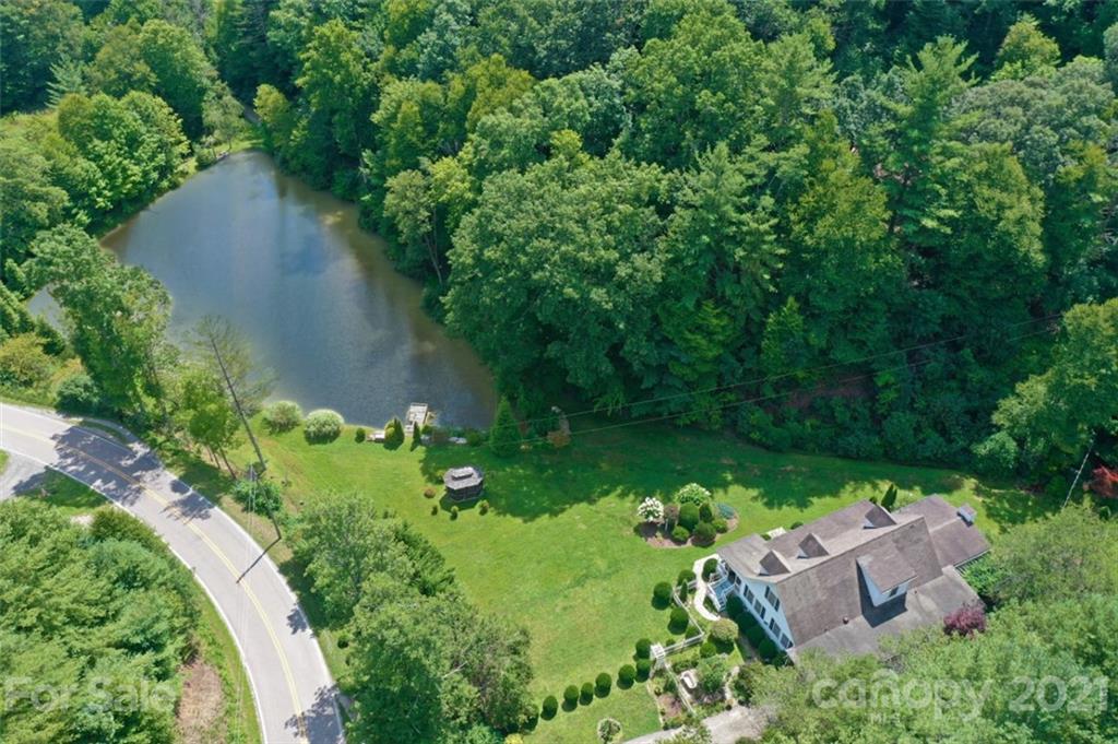 5424 Castle Ford Road Boone, NC 28607 - Photo 18 of 48 an aerial view of a house with a yard and lake view