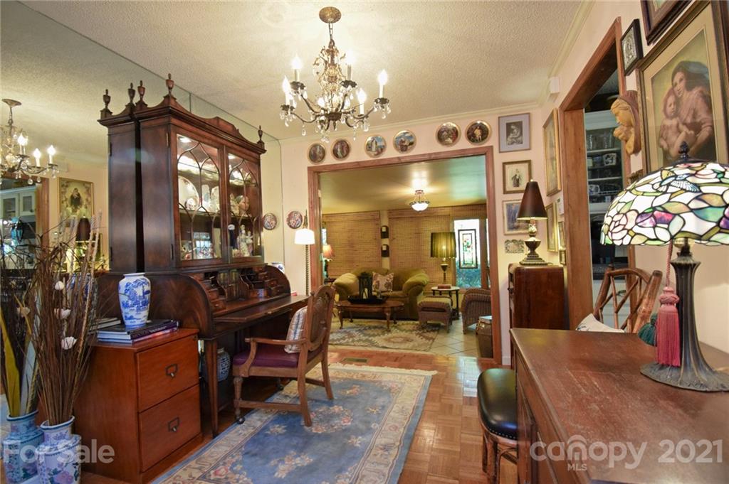 5424 Castle Ford Road Boone, NC 28607 - Photo 21 of 48 a living room filled with furniture and a chandelier