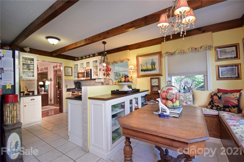 5424 Castle Ford Road Boone, NC 28607 - Photo 25 of 48 a view of a dining room with furniture and chandelier
