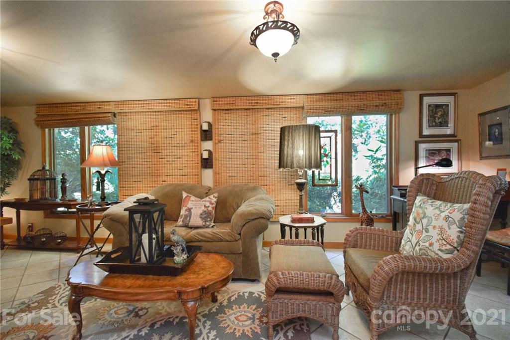 5424 Castle Ford Road Boone, NC 28607 - Photo 30 of 48 a living room with furniture a couch and large windows