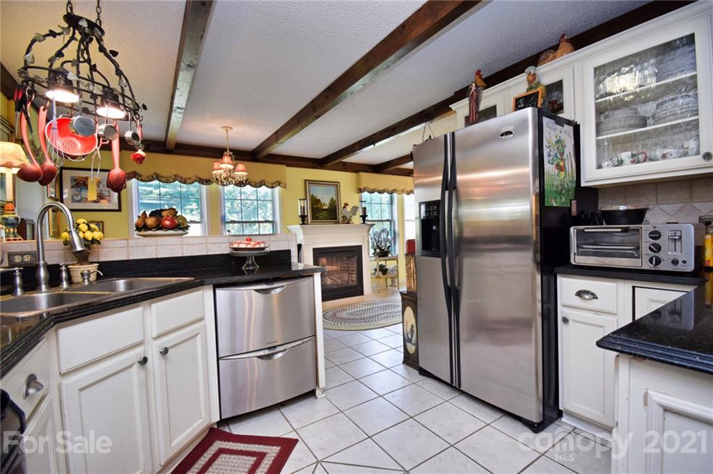 5424 Castle Ford Road Boone, NC 28607 - Photo 33 of 48 a kitchen with stainless steel appliances granite countertop a refrigerator and a sink