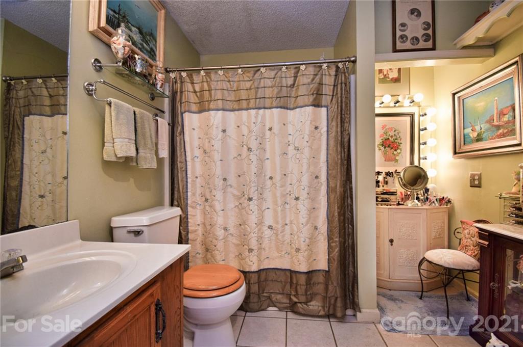 5424 Castle Ford Road Boone, NC 28607 - Photo 34 of 48 a bathroom with a sink toilet and shower