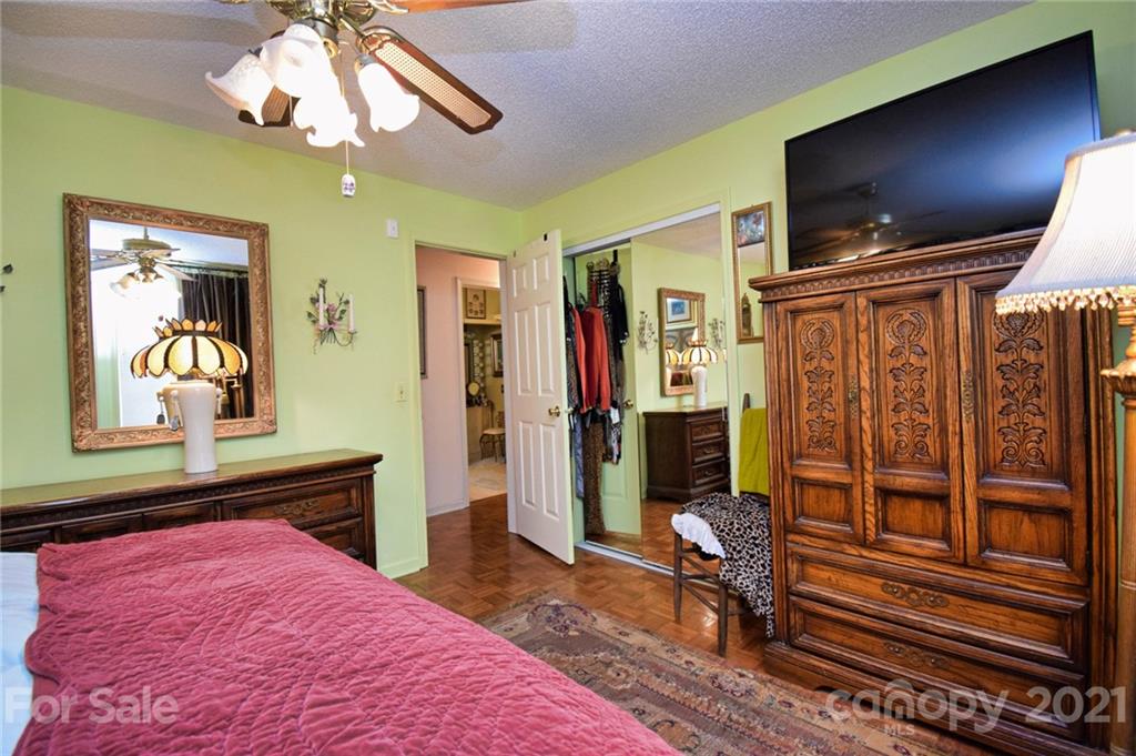 5424 Castle Ford Road Boone, NC 28607 - Photo 35 of 48 a bedroom with a bed and a flat screen tv