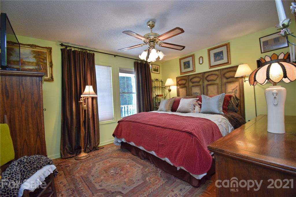 5424 Castle Ford Road Boone, NC 28607 - Photo 38 of 48 a bedroom with bed and wooden floor