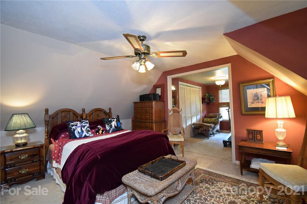 5424 Castle Ford Road Boone, NC 28607 - Photo 42 of 48 a bed room with a bed and a couch