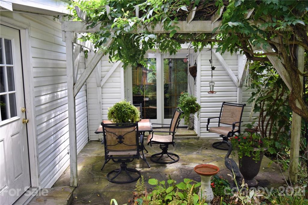5424 Castle Ford Road Boone, NC 28607 - Photo 6 of 48 a view of a chair and table in backyard of the house