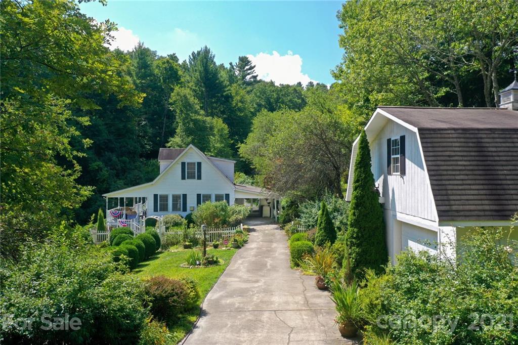 5424 Castle Ford Road Boone, NC 28607 - Photo 10 of 48 a front view of a house with a yard and trees