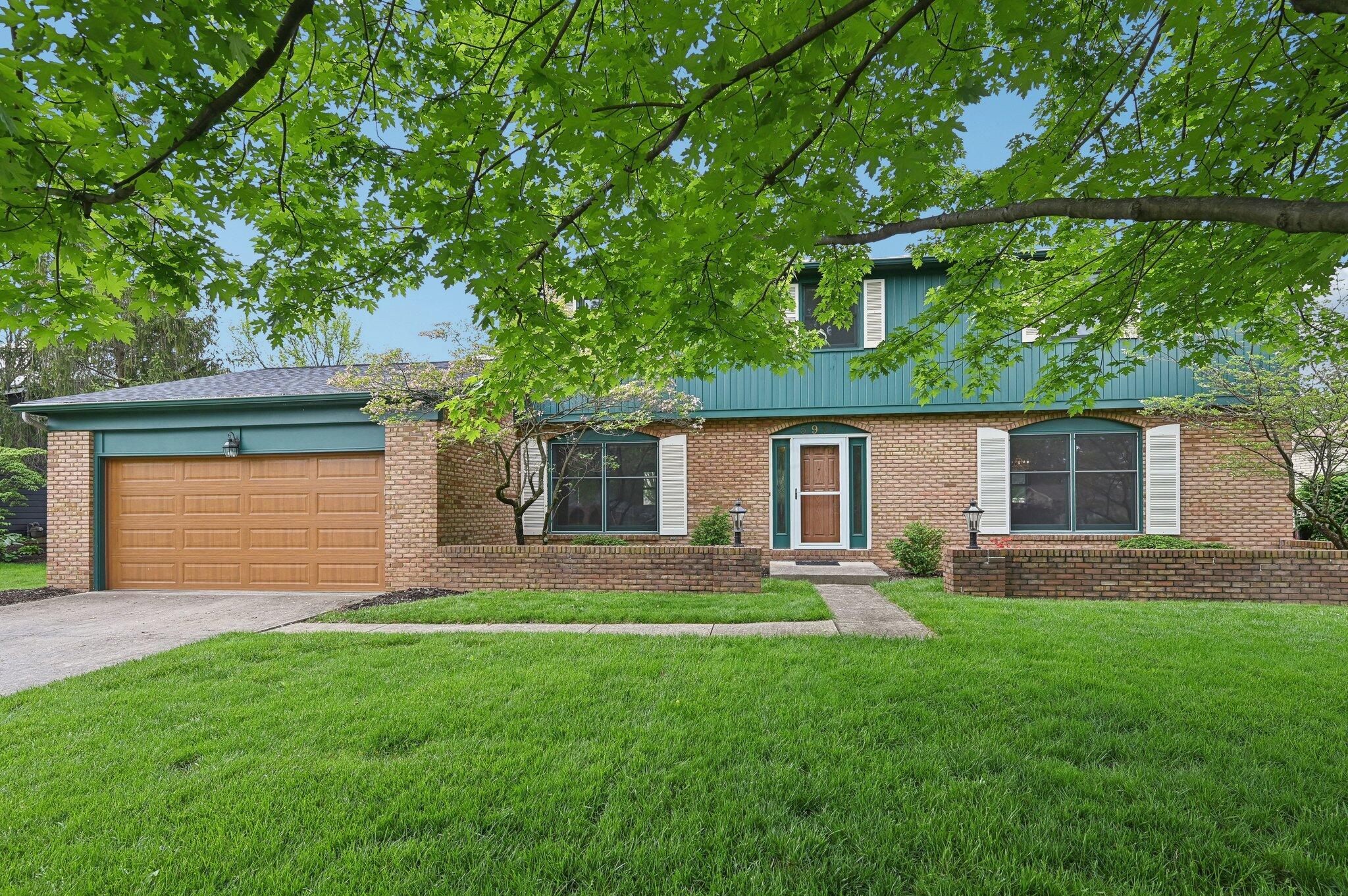 Front Exterior – Full View
Well-maintained two-story brick home with a newer roof (2023), welcoming front walkway, and mature trees offering shade and curb appeal.