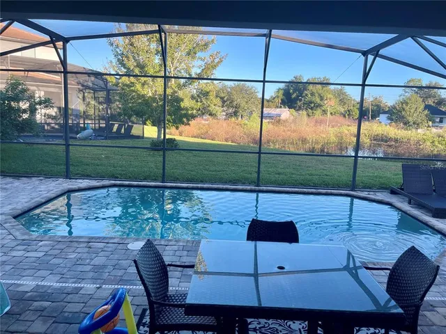 a view of an outdoor sitting area with furniture