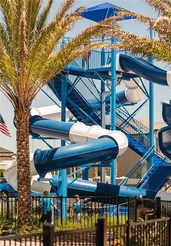 a view of a brick house with many windows
