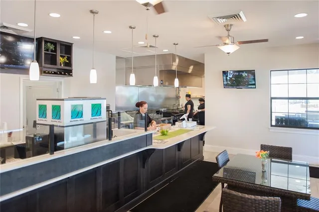 a kitchen with a sink cabinets and window
