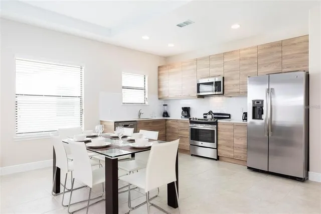 a kitchen with a sink cabinets and stainless steel appliances