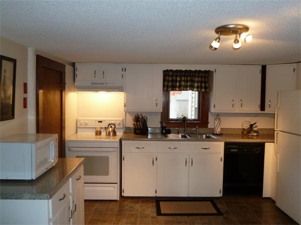 123 Lawrence Road Chicopee, MA 01013 - Photo 5 of 23 a kitchen with a sink stove and cabinets