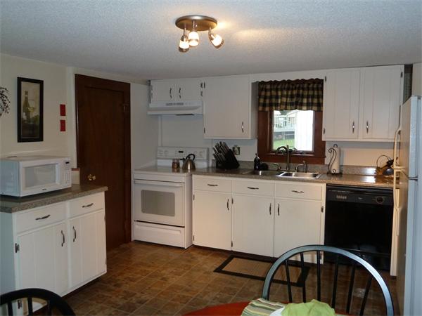 123 Lawrence Road Chicopee, MA 01013 - Photo 6 of 23 a kitchen with a white cabinets and window