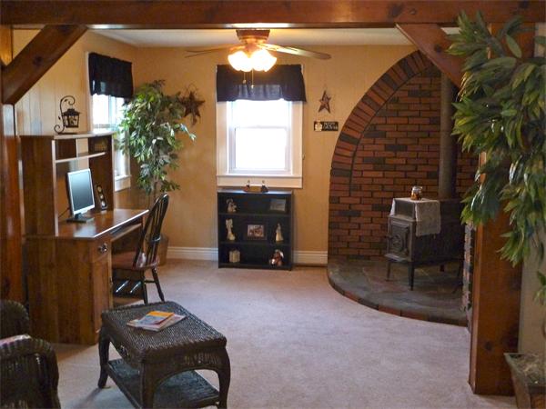 123 Lawrence Road Chicopee, MA 01013 - Photo 8 of 23 a living room with furniture and a fireplace