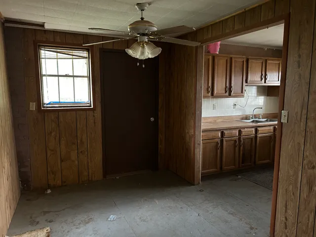 a view of a kitchen from the hallway