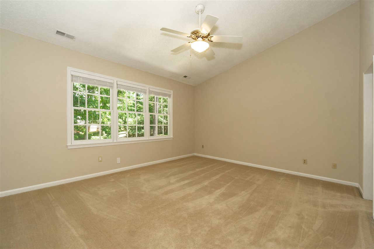 8113 Coleraine Court Raleigh, NC 27615 - Photo 20 of 28 Master Bedroom with Cathedral Ceilings and wonderful natural light. Master Bedroom