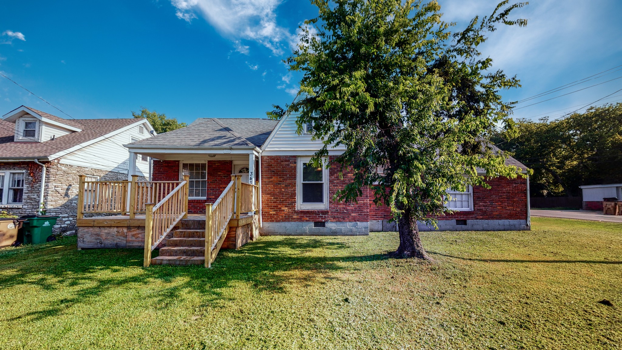 343 Neelys Bend Road Madison, TN 37115 - Photo 1 of 28 a front view of a house with garden