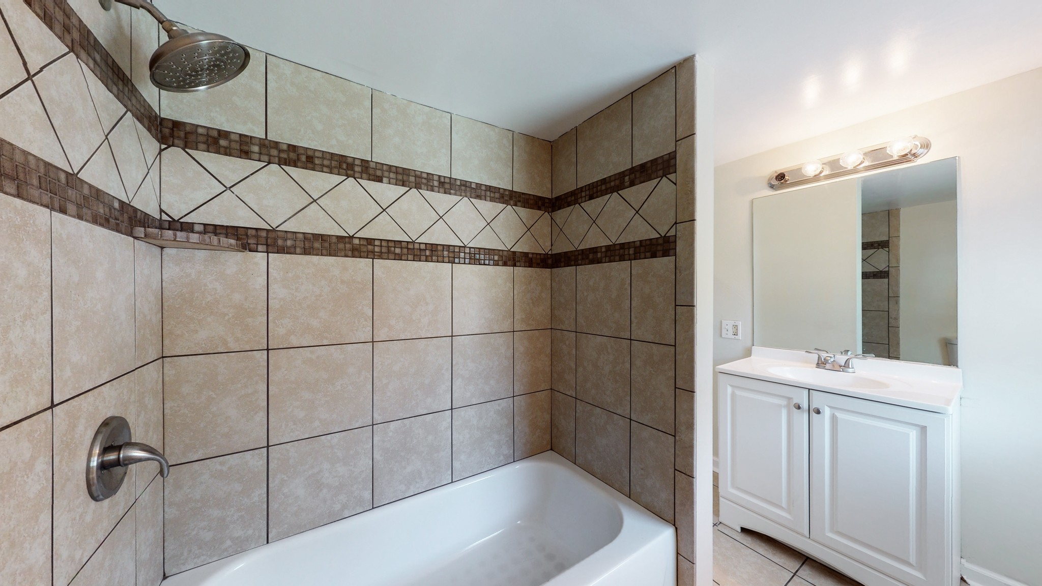 343 Neelys Bend Road Madison, TN 37115 - Photo 19 of 28 a bathroom with a bathtub and shower