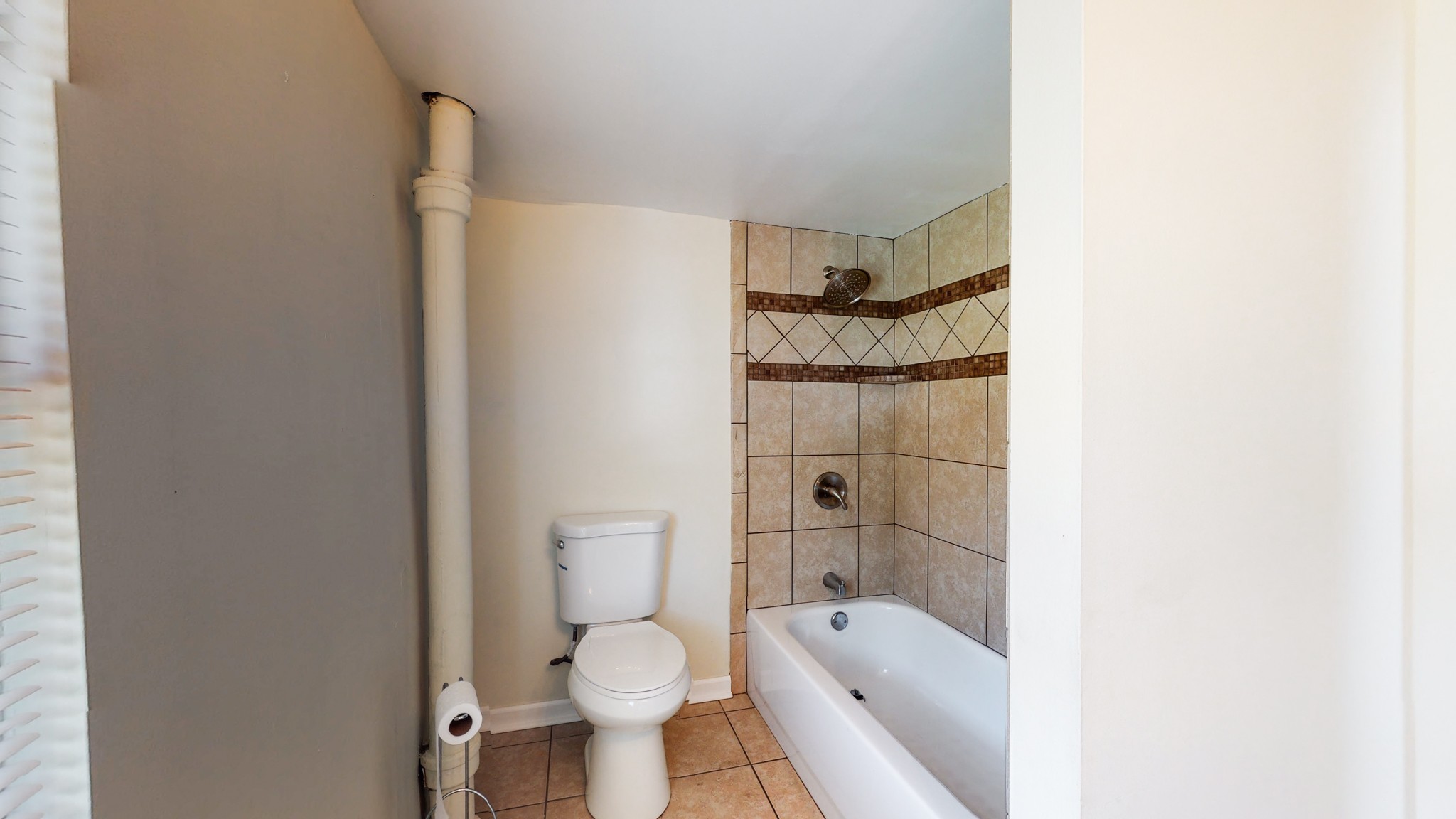 343 Neelys Bend Road Madison, TN 37115 - Photo 22 of 28 a bathroom with a toilet and a bathtub