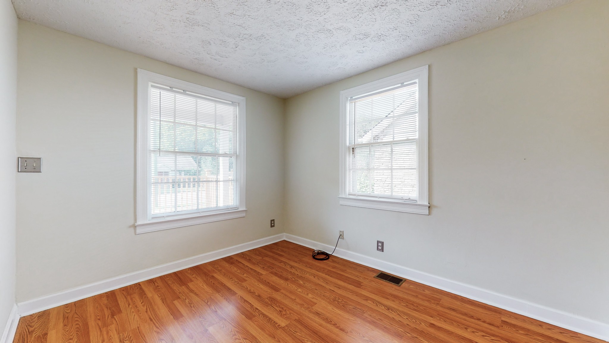 343 Neelys Bend Road Madison, TN 37115 - Photo 24 of 28 an empty room with wooden floor and windows