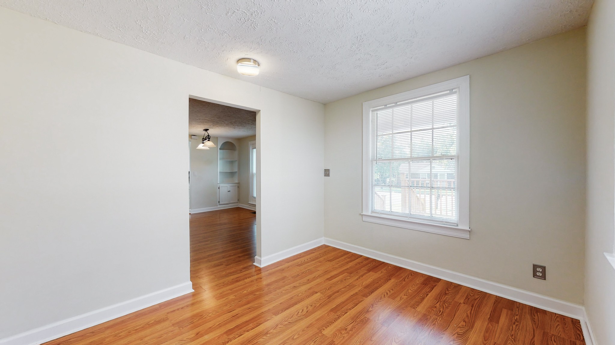 343 Neelys Bend Road Madison, TN 37115 - Photo 25 of 28 an empty room with wooden floor and windows