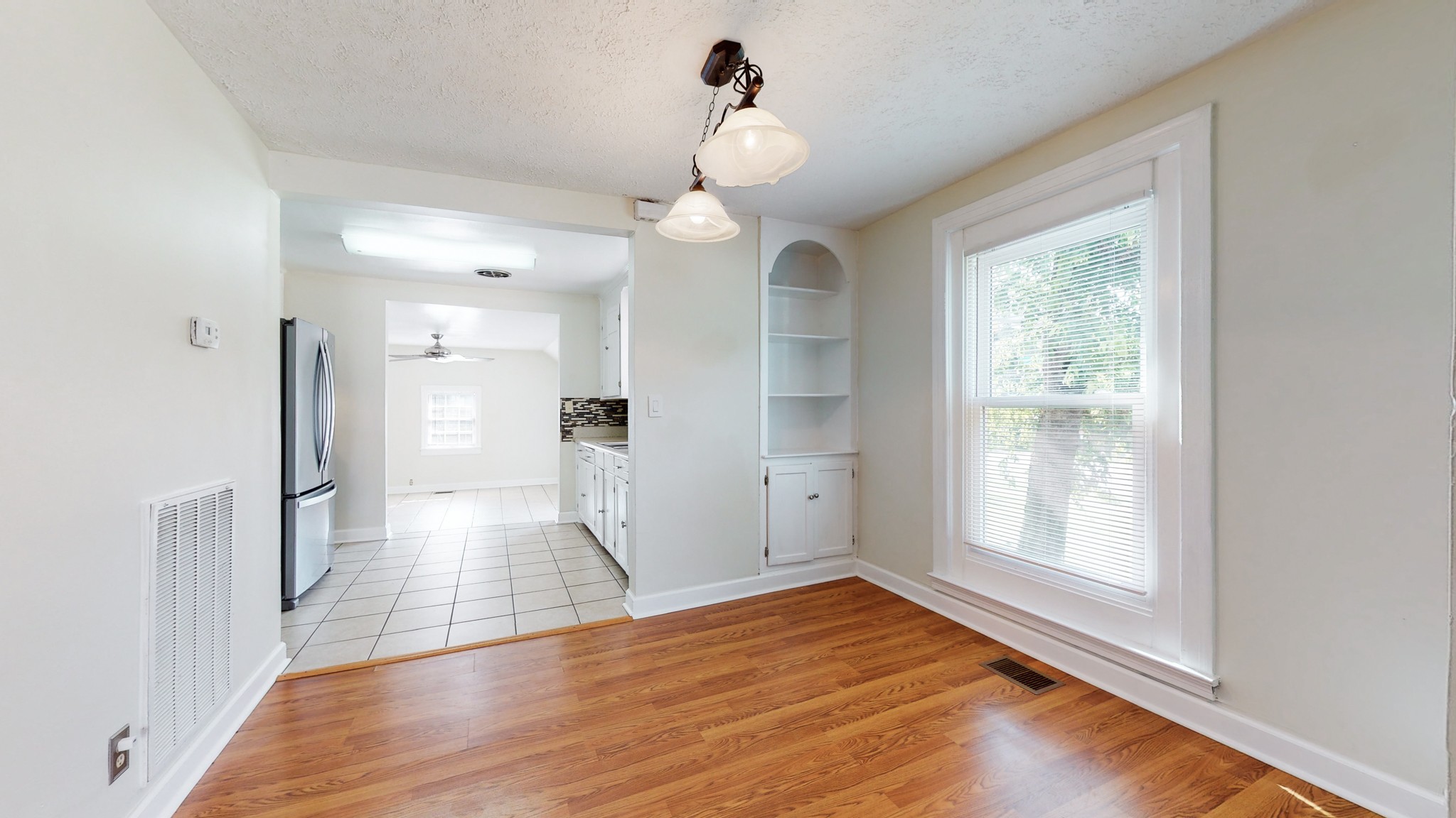 343 Neelys Bend Road Madison, TN 37115 - Photo 5 of 28 a view of empty room with wooden floor and fan