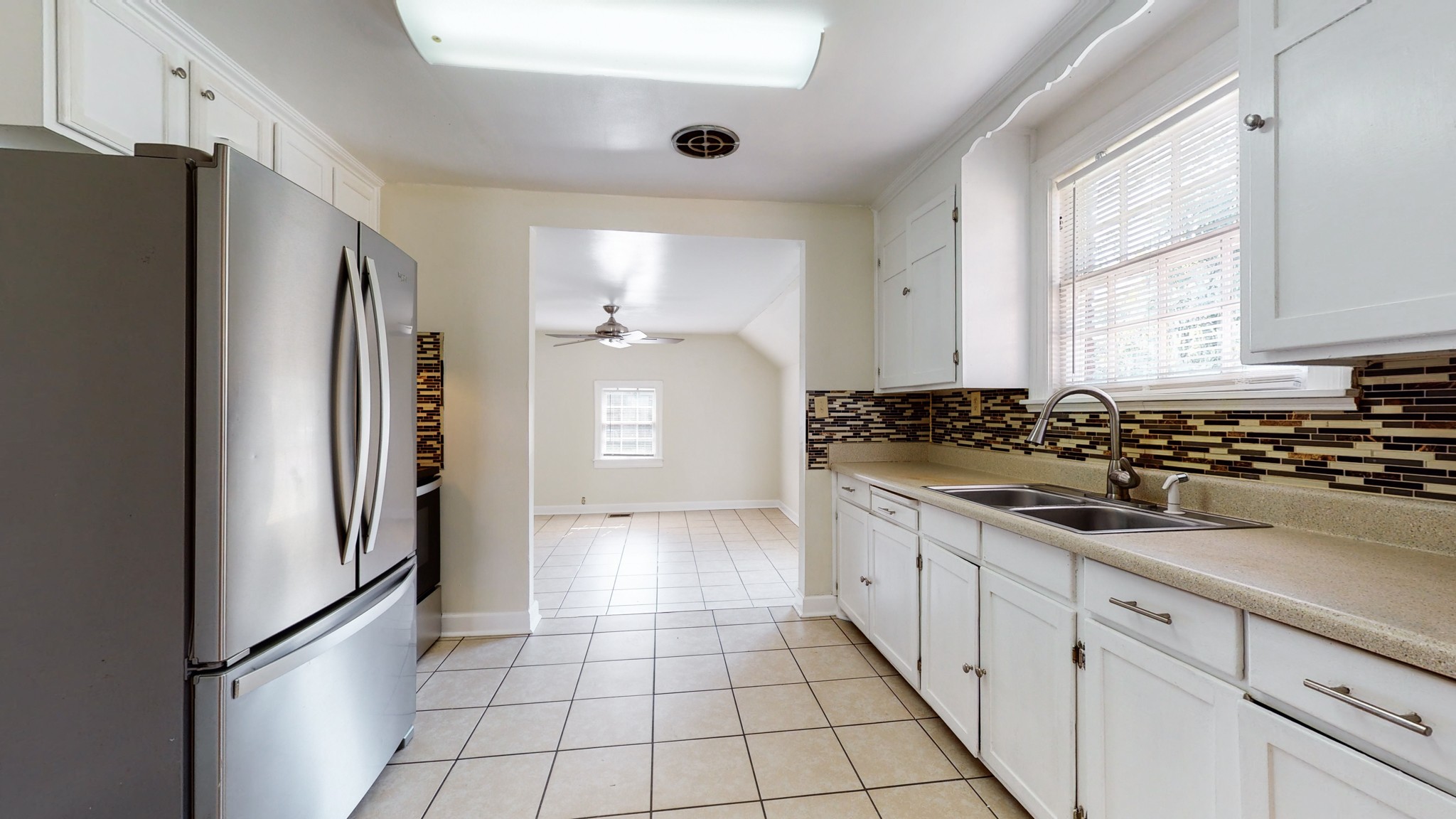 343 Neelys Bend Road Madison, TN 37115 - Photo 7 of 28 a kitchen with stainless steel appliances granite countertop a refrigerator and a sink